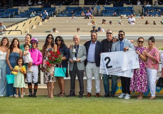 Jeffrey Sengara, the jockey, family, and racing connections in the winner's circle